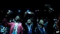 Attendees await the start of the keynote address at the Apple Worldwide Developers Conference in San Jose, Calif., Monday, June 3, 2019. (AP Photo/Jeff Chiu)