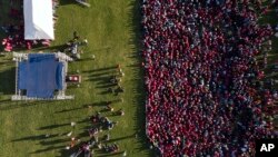 Thousands of opposition party supporters cheer leading opposition challenger Nelson Chamisa during a campaign rally in Bulawayo, Zimbabwe, July 21, 2018.