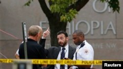 FILE - United States Secret Service police are seen standing in front of the Ethiopian Embassy in Washington Sept. 29, 2014, in connection with a shooting incident at the compound.