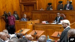 Kenyan Attorney General, Githu Muigai, right, addresses the court as David Maraga, Chief Justice of Kenya at Supreme Court, sat on Judges chair, listens, Oct. 25, 2017.