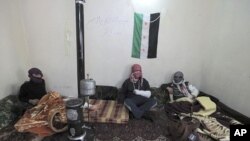 Injured members of the Free Syrian Army take refuge at a makeshift hospital in Idlib province, March 1, 2012.