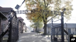 FILE - Entrance of Auschwitz at the former Nazi German death complex of Auschwitz-Birkenau in in Oswiecim, Poland.