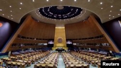 FILE - The U.N. General Assembly Hall is empty before the start of the U.N. General Assembly 76th session General Debate at United Nations Headquarters, in New York, Sept. 20, 2021.
