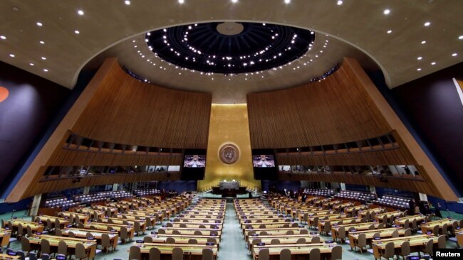 FILE - The U.N. General Assembly Hall is empty before the start of the U.N. General Assembly 76th session General Debate at United Nations Headquarters, in New York, Sept. 20, 2021.