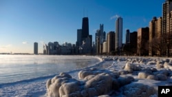 Ice forms along the shore of Lake Michigan, Feb. 19, 2015, in Chicago.