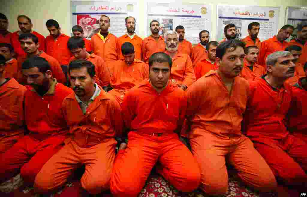Detainees are displayed for the media during a news conference by Iraq's Interior Minister in Baghdad December 2. Security forces arrested 39 al Qaeda militants, including the group's leadership in Anbar province and one of its top officers in Iraq, in ra