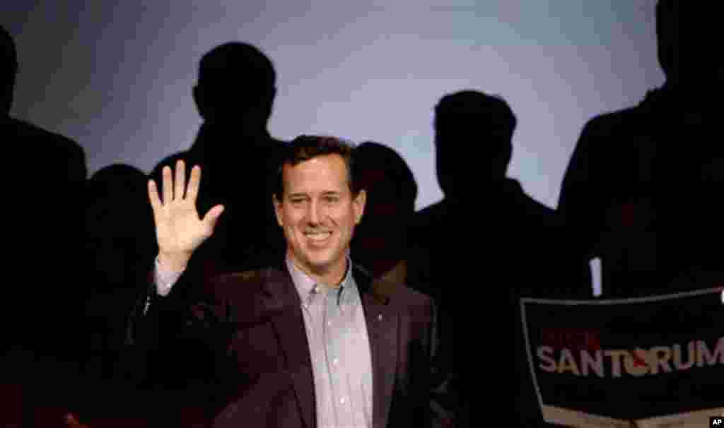 Republican presidential candidate, former Pennsylvania Sen. Rick Santorum greets supporters during a rally, Friday, March 16, 2012, in Osage Beach, Mo. (AP Photo/Charlie Riedel)