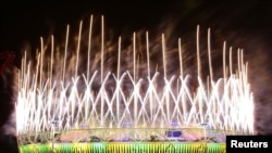 Fireworks explode over the Olympic Stadium during the closing ceremony of the London 2012 Olympic Games August 12, 2012. 