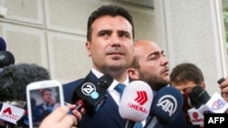 FILE - Leader of the Social Democratic Union of Macedonia (SDSM) Zoran Zaev, speaks to the press after receiving a mandate by Macedonia's President on behalf of the parliamentary's majority, in Skopje, May 17, 2017.