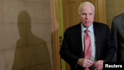 FILE - Senator John McCain arrives at a meeting on Capitol Hill in Washington, Jan. 31, 2017.