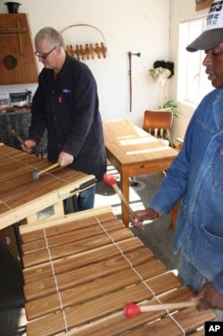 AMI’s Christian Carver (left) and Mark Komsana play ‘quintessential’ and ‘louder’ African marimbas