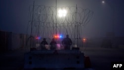 Members of the U.S. Border Police guard the international bridge in Texas, as seen from Piedras Negras, Coahuila state, Mexico, Feb. 6, 2019. 