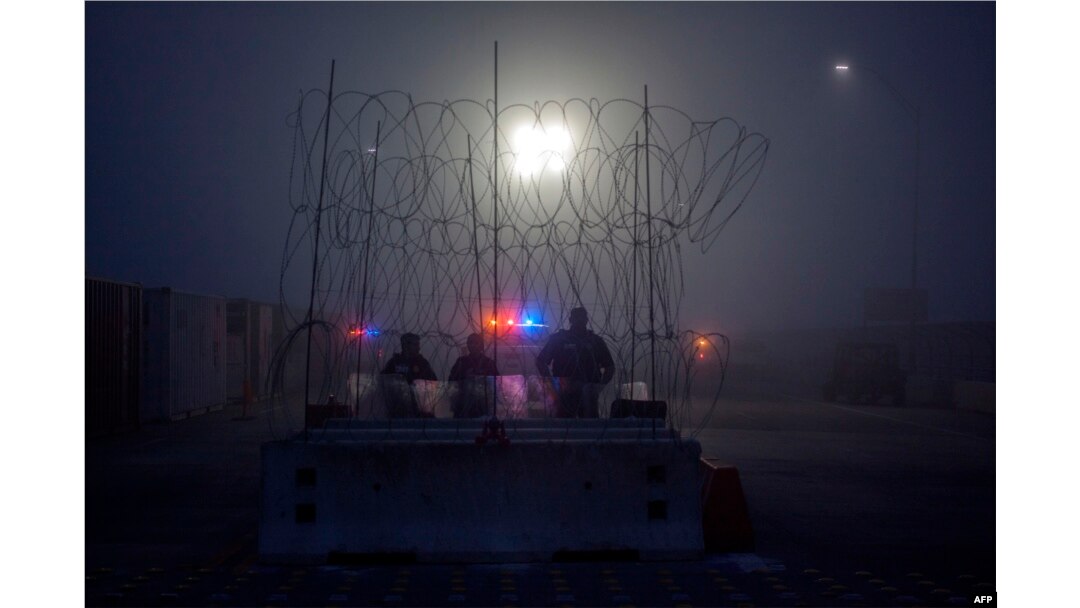 Members of the U.S. Border Police guard the international bridge in Texas, as seen from Piedras Negras, Coahuila state, Mexico, Feb. 6, 2019.