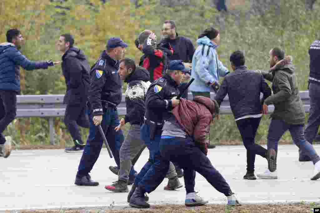 Migrants clash with Bosnian police in Maljevac, Bosnia. Bosnian police blocked hundreds of migrants from crossing into Croatia, a European Union member, reflecting tensions as the country struggles with the influx.