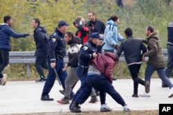 Migrants clash with Bosnian police in Maljevac, Bosnia, Oct. 24, 2018.