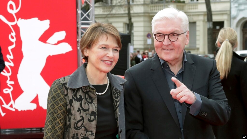 FILE - German President Frank-Walter Steinmeier (R) is seen with his wife, Elke Buedenbender in Berlin, Germany, Feb. 9, 2019. 