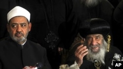 Ahmed el-Tayeb the grand sheik of Cairo's Al-Azhar, the pre-eminent theological institute of Sunni Islam, left, and Pope Shenouda III, the head of the Coptic church, talk to the media in Cairo, Egypt, Sunday Jan. 2 , 2011