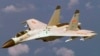 FILE - A U.S. military official says two Chinese J-11 fighters, like one pictured here, flew out to intercept a U.S. EP-3 Aries aircraft, coming so close that they forced the pilot to descend a couple hundred feet.