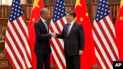 U.S. President Barack Obama (L) and Chinese President Xi Jinping shake hands before a bilateral meeting in Hangzhou, China, Sept. 3, 2016. An agreement they reached on climate change is being seen as a major milestone.