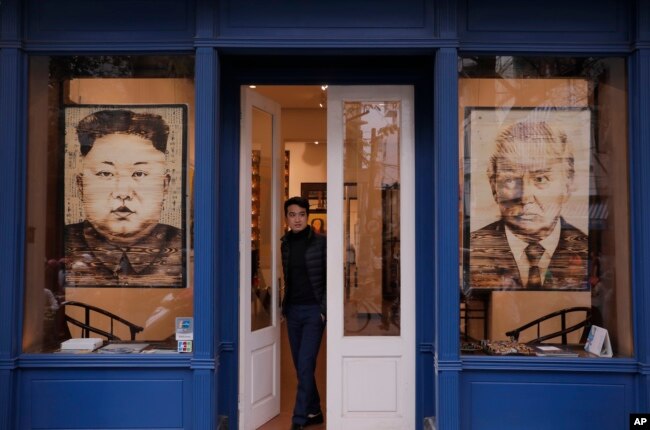 Artworks featuring U.S. President Donald Trump and North Korean leader Kim Jong Un are displayed at a gallery, Feb. 28, 2019, in Hanoi, Vietnam.