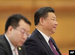 Chinese President Xi Jinping, right, attends a meeting with Serbian President Tomislav Nikolic at the Great Hall of the People, March 30, 2017 in Beijing, China.