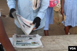 A newspaper vendor is seen in Westfield, Banjul, Gambia, June 7, 2017.