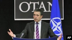 NATO Secretary General Anders Fogh Rasmussen speaks during a media conference after a meeting of NATO defense ministers at headquarters in Brussels, March 10, 2011