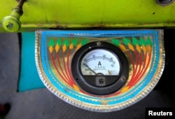 An electric gauge is seen in the cab of a decorated truck in Faisalabad, Pakistan, May 4, 2017.