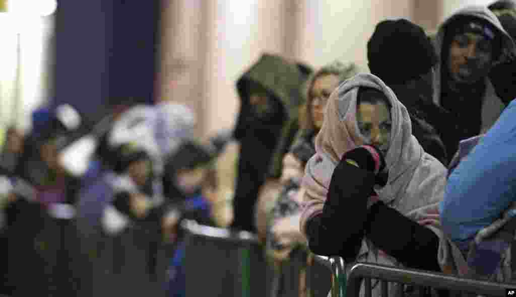 Dina Jones, right, waits outside a Best Buy in Mayfield Heights, Ohio ahead of its Black Friday sale, November 22, 2012.