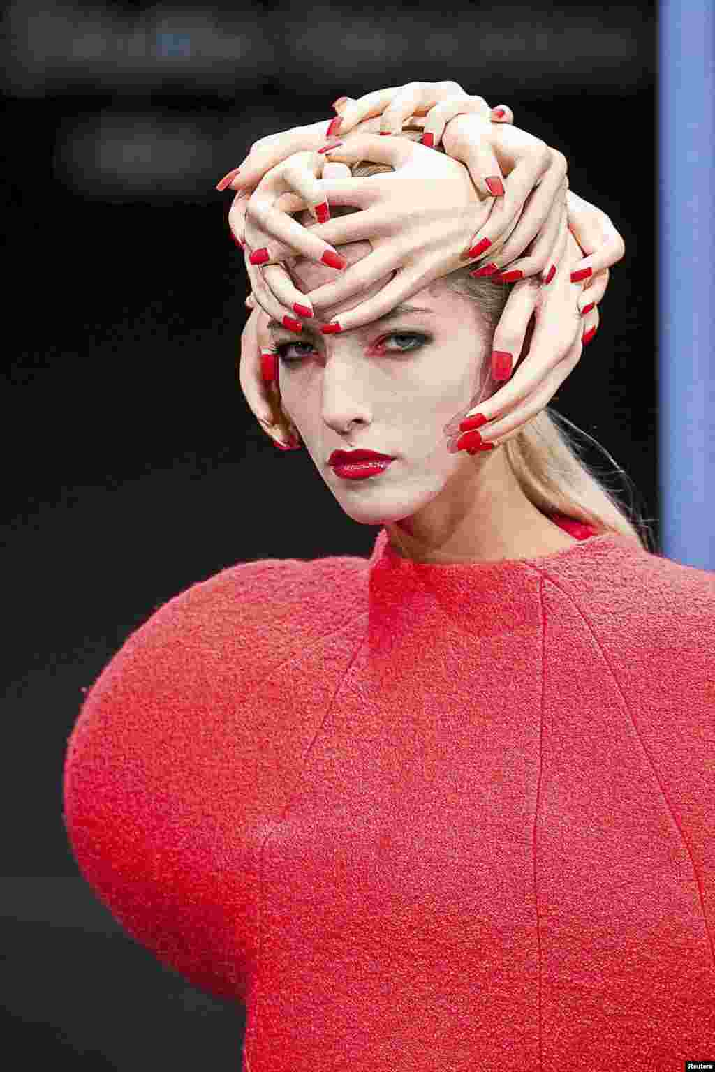 A model presents creation by Anita Zmurko-Sieradzka during a fashion event called Fashionable East - Fashion Week in Bialystok, eastern Poland, Aug. 1, 2015. 