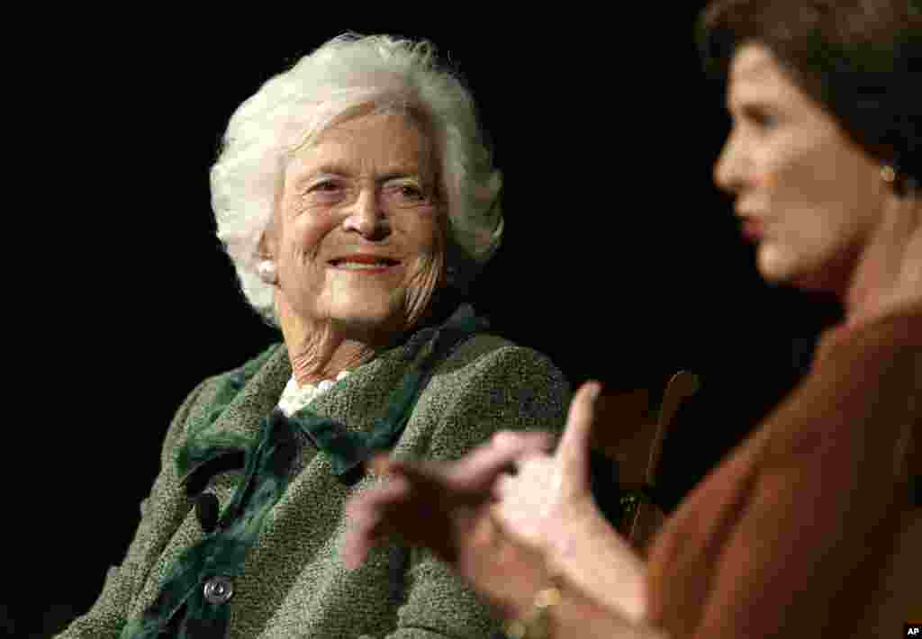 Former first ladies Barbara Bush, left, and Laura Bush, take part in the Enduring Legacies of America’s First Ladies conference, Nov. 15, 2012, in Austin, Texas. 