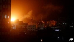An explosion caused by Israeli airstrikes is seen from Hamas security building in Gaza City, March 25, 2019. 