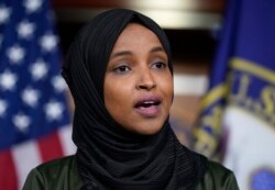 FILE - Rep. Ilhan Omar, D-Minn., speaks to reporters in the wake of anti-Islamic comments made by Rep. Lauren Boebert, R-Colo., who likened Omar to a bomb-carrying terrorist, during a news conference at the Capitol in Washington, Nov. 30, 2021.
