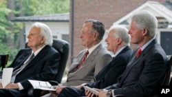 Former presidents, from right, Bill Clinton, Jimmy Carter and George H.W. Bush, look on with Rev. Billy Graham, left, during a dedication for the Billy Graham Library in Charlotte, N.C., Thursday, May 31, 2007. (AP Photo/Chuck Burton)
