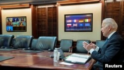 U.S. President Joe Biden is seen in a White House handout photo as he speaks with European leaders about Russia and the situation in Ukraine during a secure video teleconference from the Situation Room of the White House in Washington, Jan. 24, 2022. 