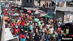 Demonstrators march through the streets of Port-au-Prince during an anti-government protestDecember 5, demanding the resignation of Hatian President Michel Martelly. 