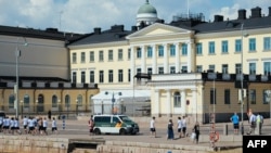 Police are seen in front of the Presidential Palace in Helsinki, Finland, July 14, 2018, ahead of the meeting between U.S. President Donald Trump and his Russian counterpart, Vladimir Putin.