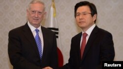 U.S. Defense Secretary James Mattis (L) shakes hands with South Korea's acting President Hwang Kyo-ahn (R) prior their meeting at the Government Complex in Seoul, South Korea February 2, 2017.