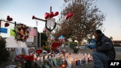 David Lem pays his respects at a memorial near the Inland Regional Center in San Bernardino, Calif., Dec. 5, 2015. Fourteen people were killed at the center on Dec. 2, 2015, in a mass shooting.