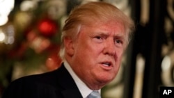 FILE - President-elect Donald Trump speaks to reporters at Mar-a-Lago, Dec. 28, 2016, in Palm Beach, Florida. 