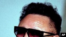North Korea's leader Kim Jong Il speaks at Khasan railway station 300 kms (187 miles) south of Vladivostok, Thursday, July 26, 2001. North Korea's leader Kim Jong Il started a ten day train journey across Russia on Thursday, heading for Moscow on the Tran
