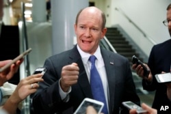 Sen. Chris Coons, D-Del., speaking to reporters on Capitol Hill in May 2017, is vice chairman of the Senate Ethics Committee.