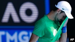 Defending men's champion Novak Djokovic of Serbia practices on Margaret Court Arena ahead of the Australian Open tennis championship in Melbourne, Australia, Jan. 13, 2022. 