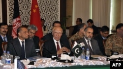 In this handout photograph released by the Associated Press of Pakistan (APP) on Feb. 6, 2016, Pakistan's National Security Advisor Sartaj Aziz (C) chairs the third round of four-way peace talks with Afghanistan, US and Chinese delegates in Islamabad.