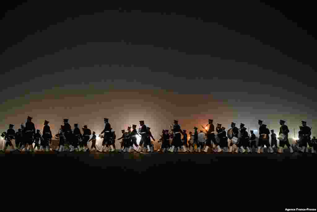 Soldiers participate in a rehearsal for the upcoming Republic Day Parade in New Delhi, India.