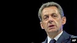 France's President and candidate for re-election in the 2012 election, Nicolas Sarkozy delivers a speech before building trade professionals as part of his campaign, in Paris, April 17, 2012.