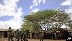 Kenyan security forces search at a village near near Liboi, Kenya's border town with Somalia, October 15, 2011.