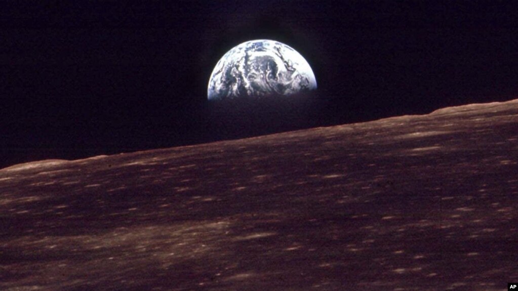 FILE - The Earth shines over the horizon of the Moon in this Dec. 24, 1968, photo shot by the astronauts on Apollo 8. (NASA)