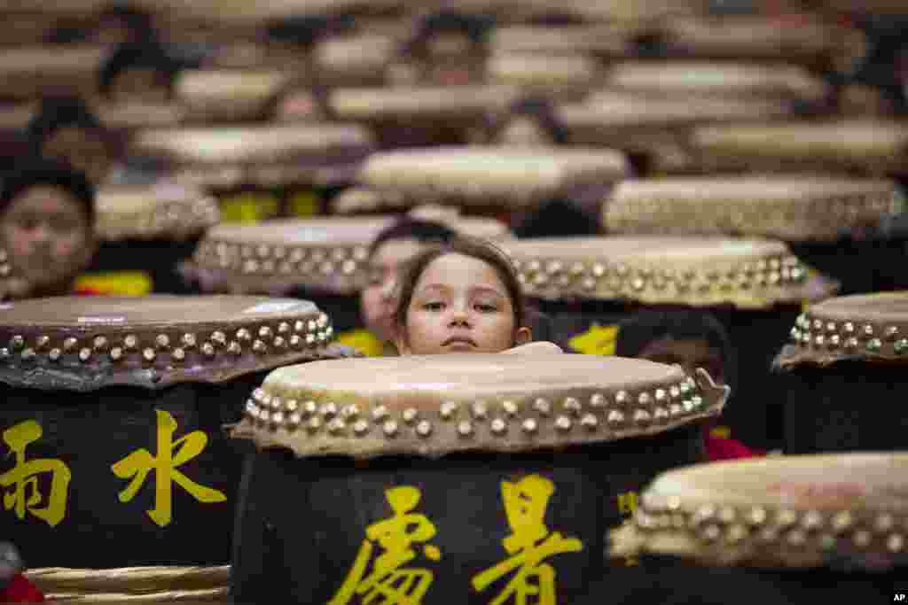 Young drummers preparr for the performance of &quot;A Flourish of Hundreds Drums&quot; in Kuala Lumpur, Malaysia,.