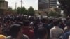 Hundreds of Iranian Kurds gather outside a municipal building in Baneh, Iran, for an anti-government protest, April 26, 2018.
